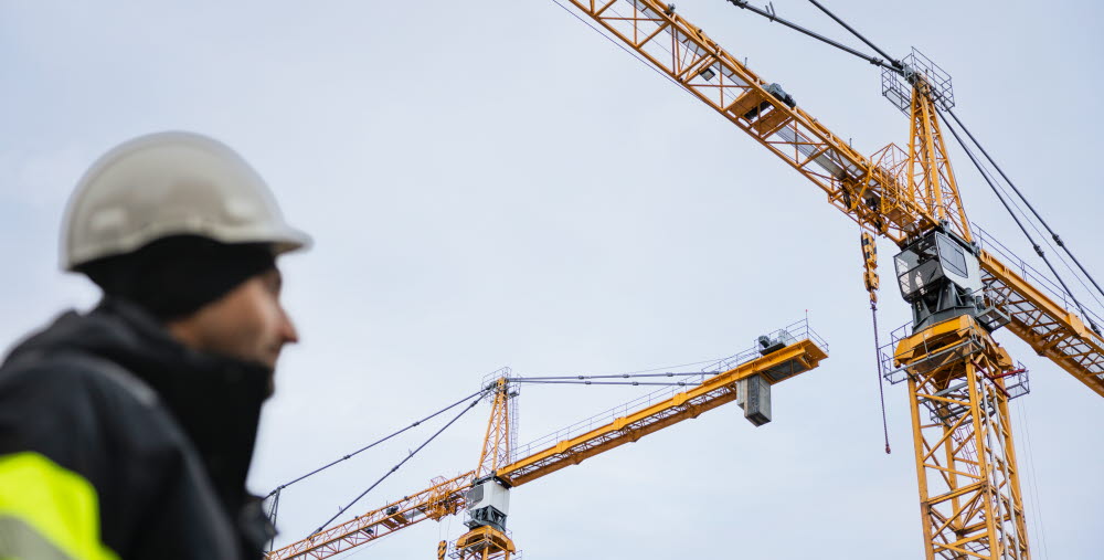 Byggarbetare på byggarbetsplats.